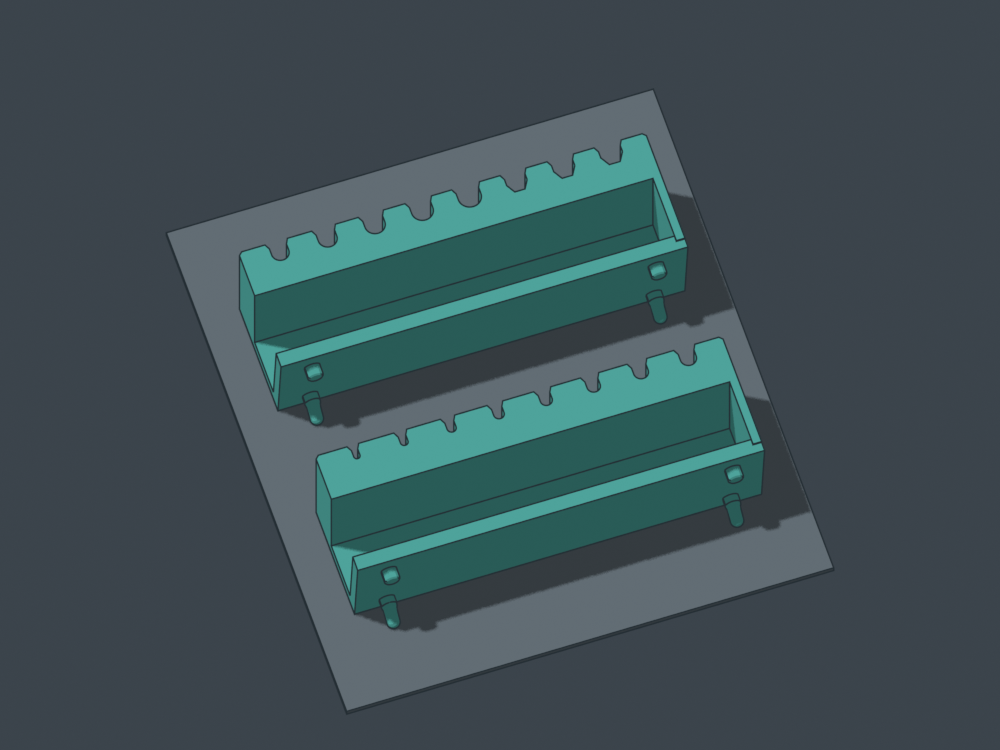 Both strips print flat top down. The supplied job adds local peg supports and brims. These CAD poses illustrate separate plates.